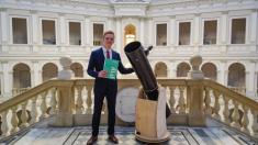 Kacper Łobodecki with his thesis and the built telescope