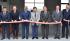 Photo of people cutting the ribbon during the opening of the Laboratory of the Aerospace Research Center