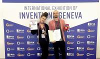 Photo of team representatives with awards received at the exhibition in Geneva