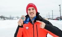 Photo of Marek Kania with a bronze medal
