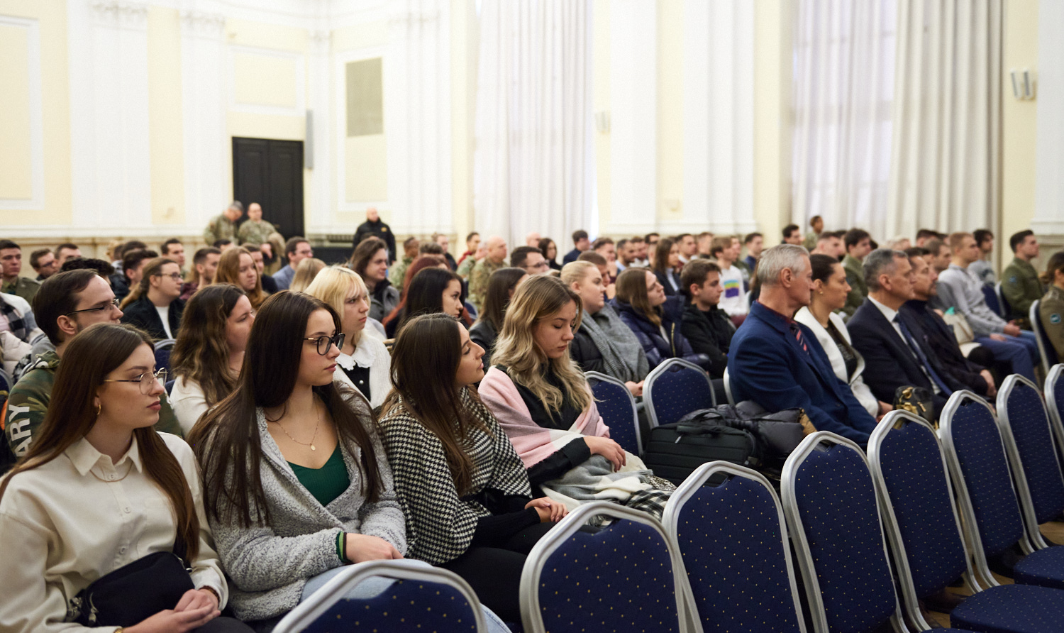 Photo of the guests who are sitting and participating in the meeting 