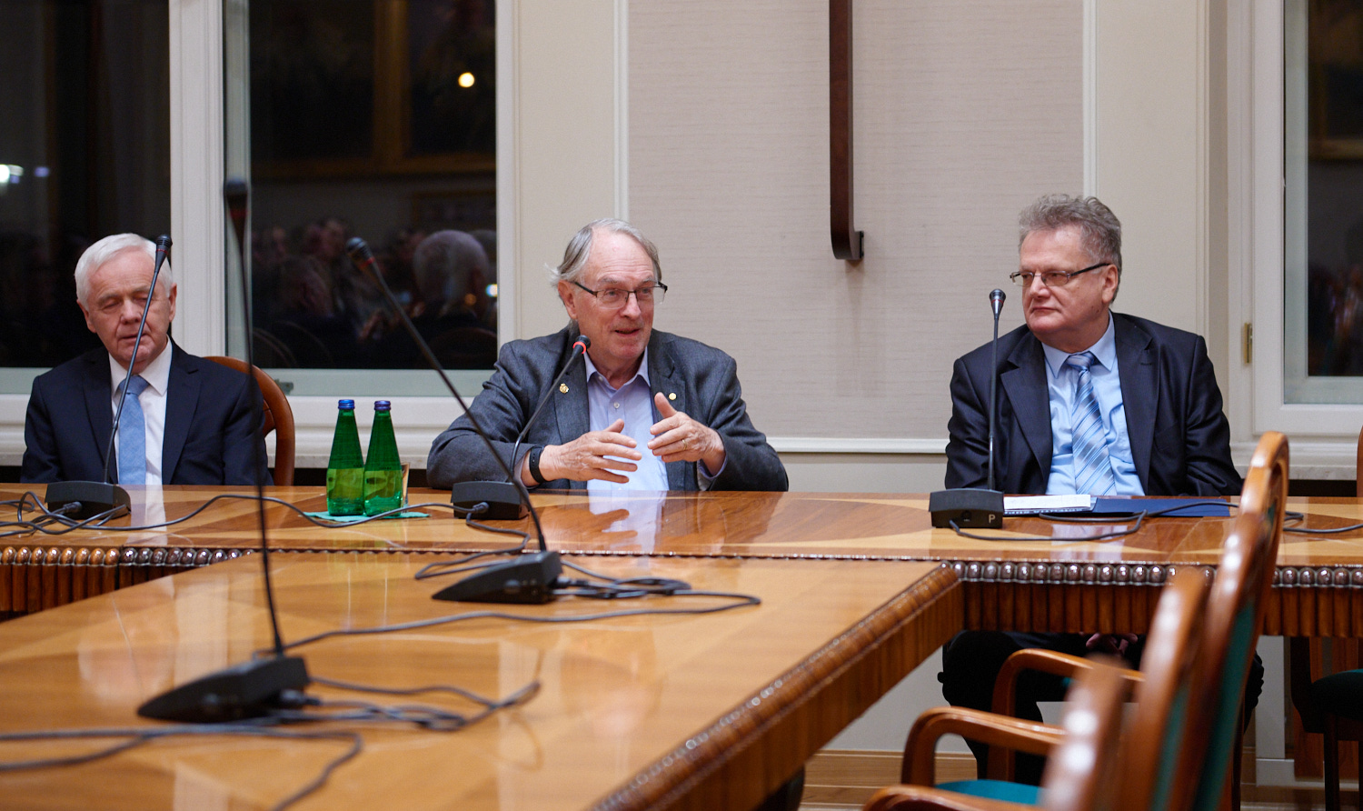 Photo of Prof. Franciszek Krok, Prof. M. Stanley Whittingham and Prof. Stanisław Janeczko who are sitting at the table