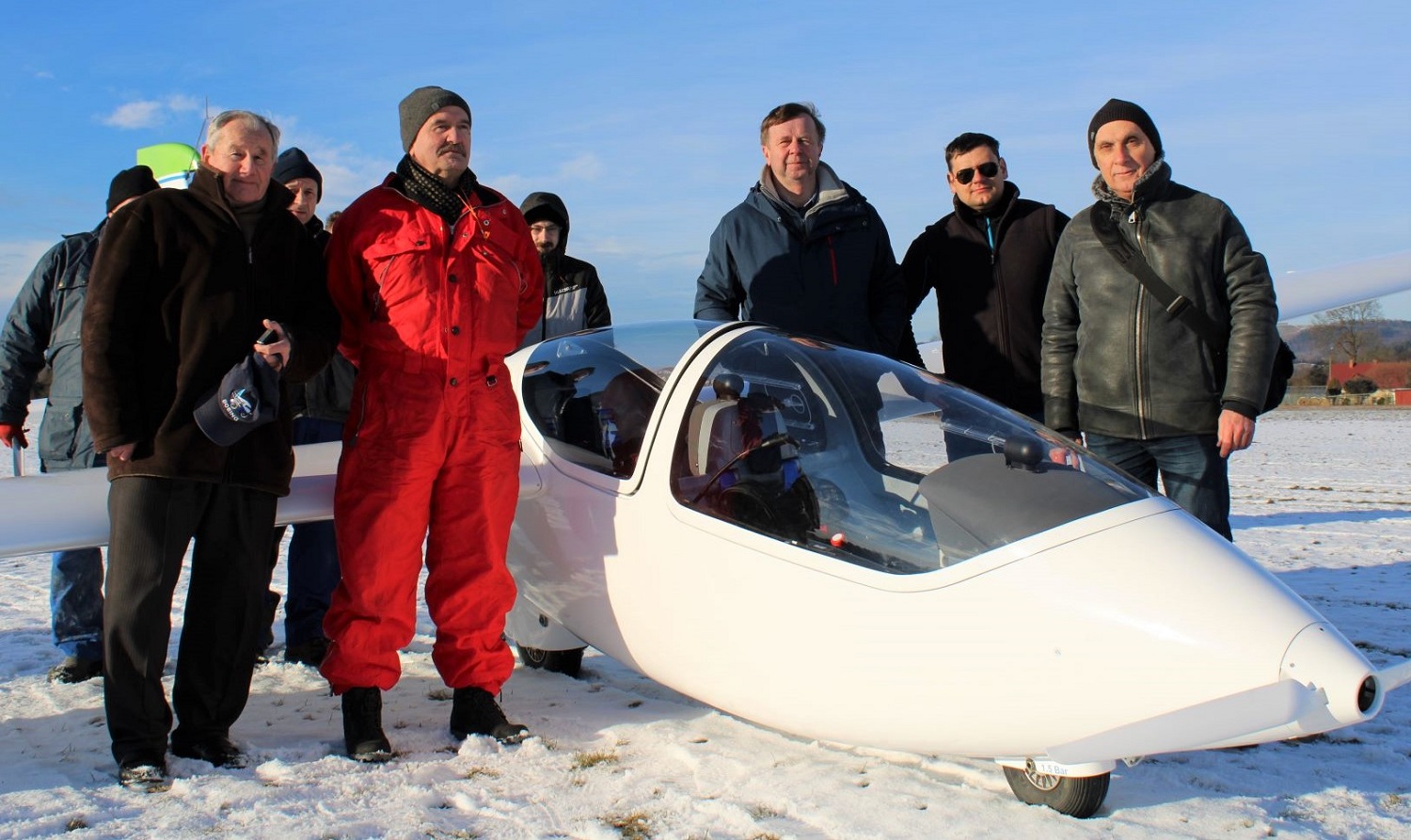 Photo of PW-X10 and a group of standing people