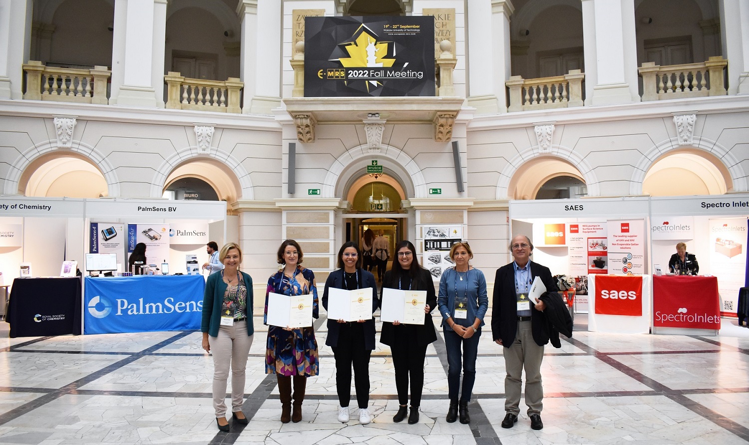 Photo of organizers and  three winners of the competition for doctoral students