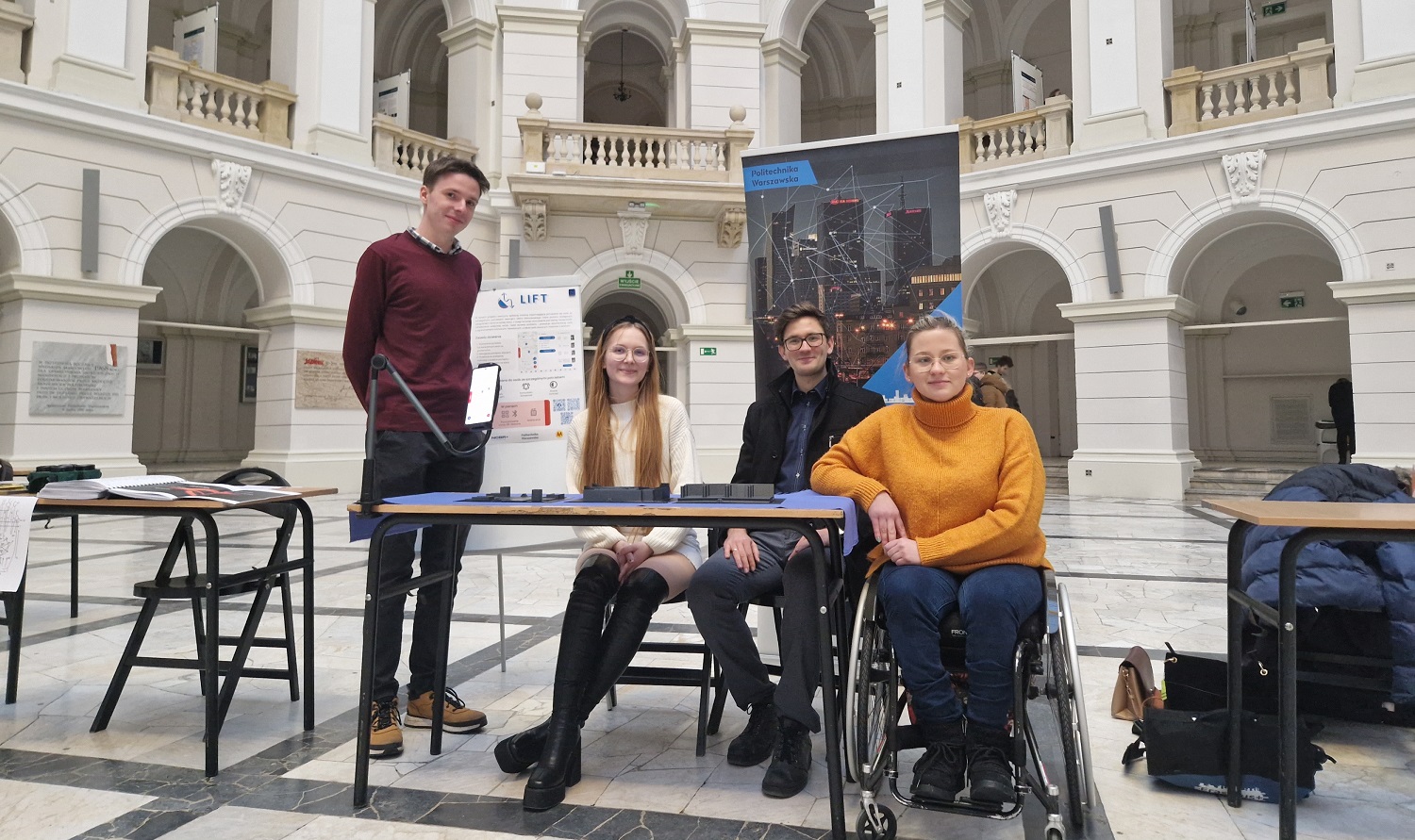 Photo of members of the LIFT application design team in the Main Building of the Warsaw University of Technology