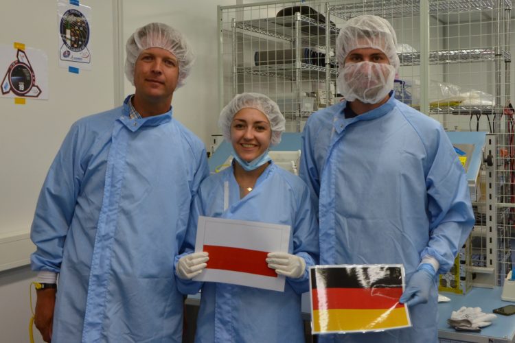 A photo to commemorate the successful integration. In the photo, left to right: Michiel van Bolhuis, representative of ISL; Inna Uwarowa, PW-Sat2 Coordinator; and Martin Langer, Move-II Team Coordinator Photo: PW-Sat2/Astronautic Student Research Group