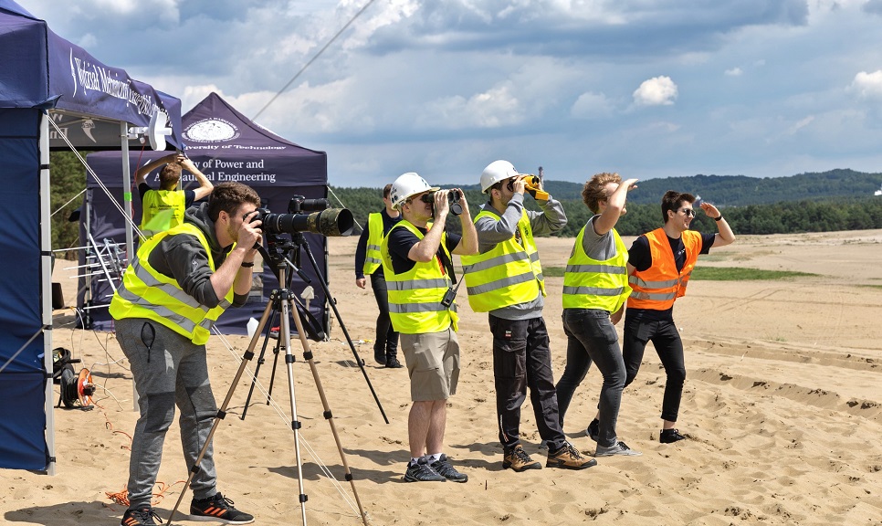 Photo of members of the Students' Space Association watching the flight of the FOK rocket