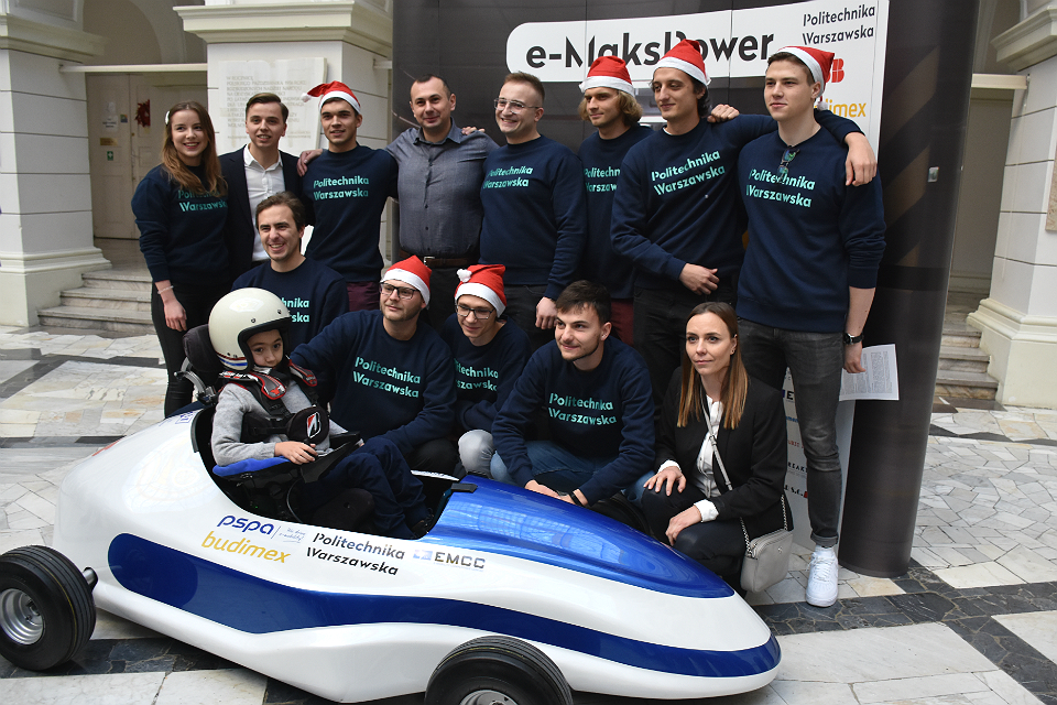 Maks with his parents and the constructors of the e-MaksPower vehicle; photo: BPI