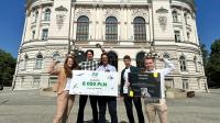 In the photo, the creators of the Emergency Guard System project standing in front of the Main Building of the Warsaw University of Technology