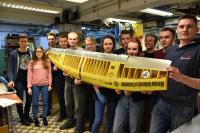 The SAE AeroDesign Team and a wing of one of the previous years’ aircraft. These models are now used for testing, photo: Office for Promotion and Information